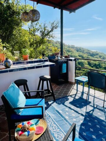 outdoor deck with bar and stove